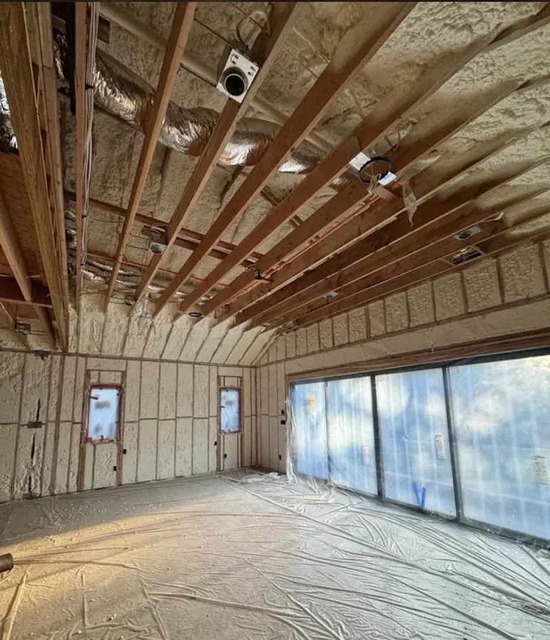 Interior walls and ceiling insulated with spray foam during new construction in Hainesport